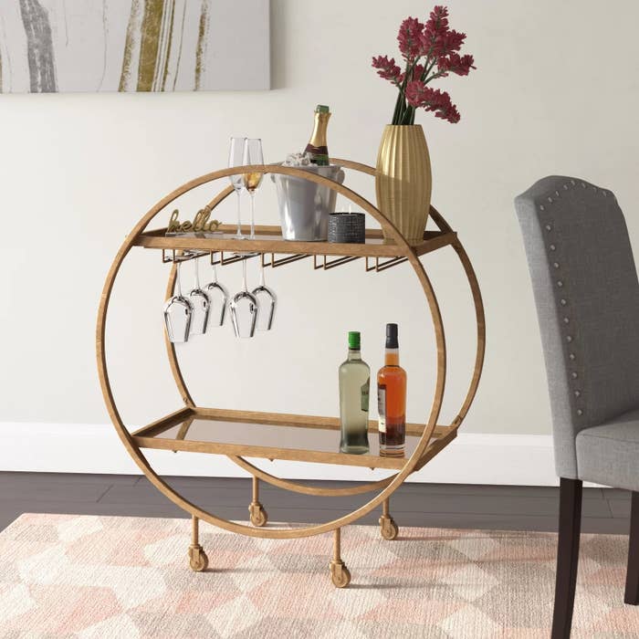 The bar cart with items on shelves