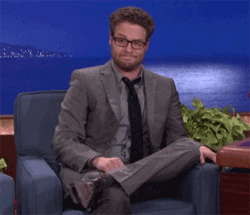 Seth Rogen shrugging his shoulders during a television interview