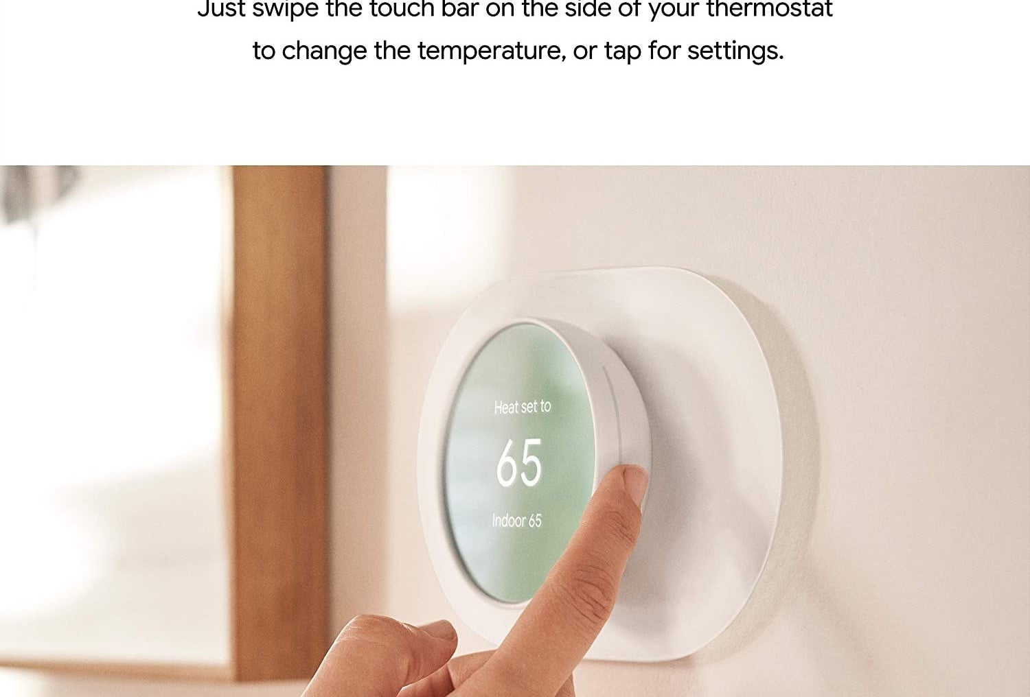 Model adjusting temperature on Google Nest thermometer