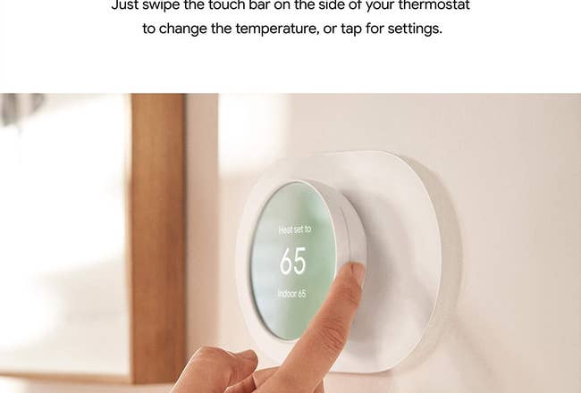 Model adjusting temperature on Google Nest thermometer