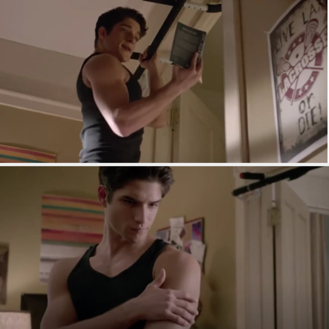 Scott does pull-ups with one arm while reading with the other and then touches his muscles