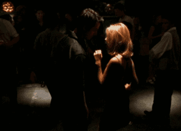 Buffy dancing in front of Xander