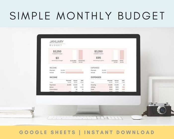 desktop computer with the monthly budget tracker spreadsheet displayed on the screen
