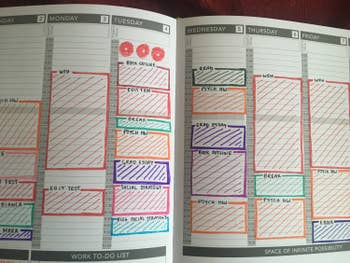 Jasmin Suknanan showing the inside of her planner that is color-coded with the pens