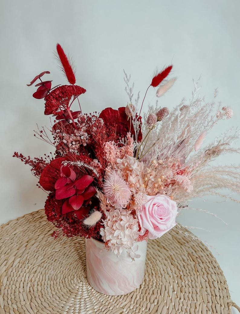 huge bouquet of dried florals in red and pink tones