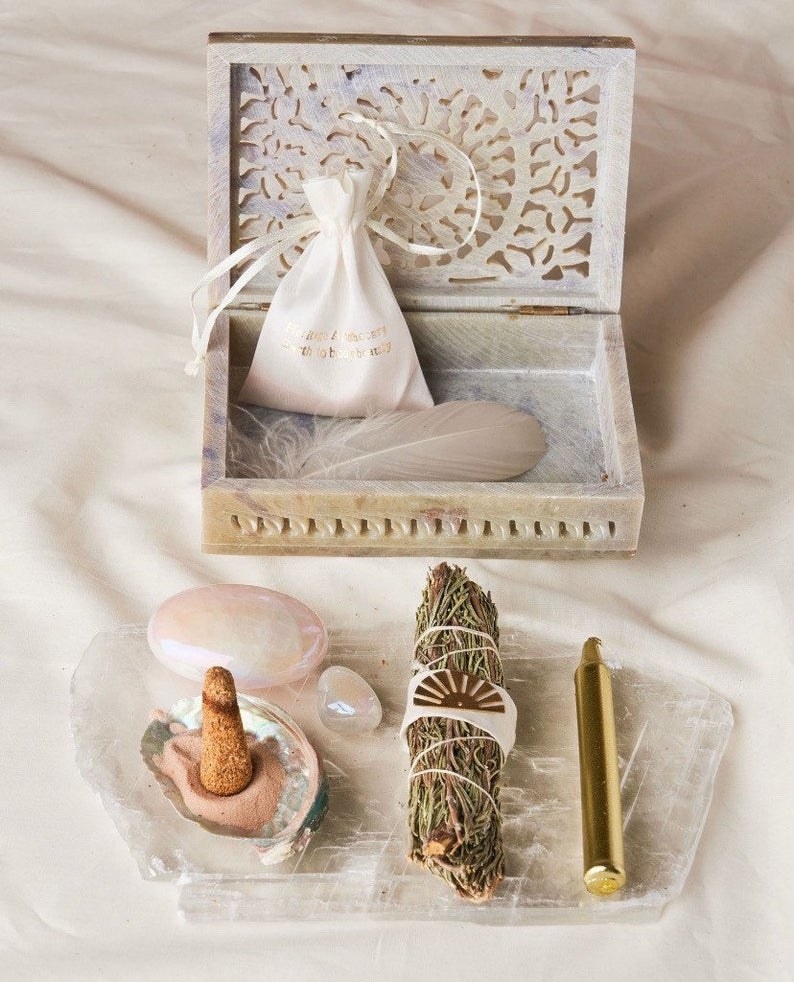 The Surrender Kit with crystals, feathers, sand, incense, and more