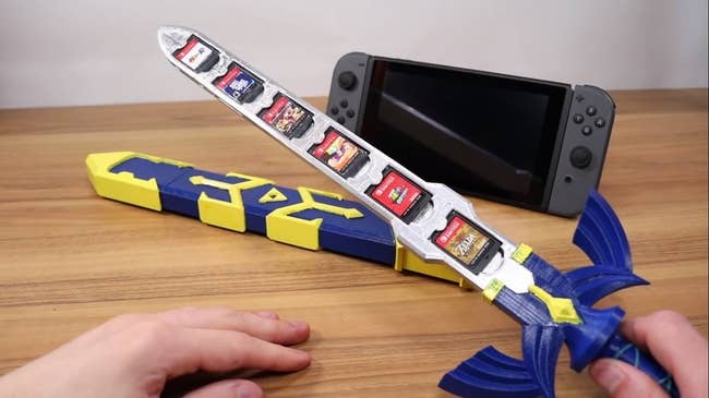 master sword with sheath that has indents to fit six games 