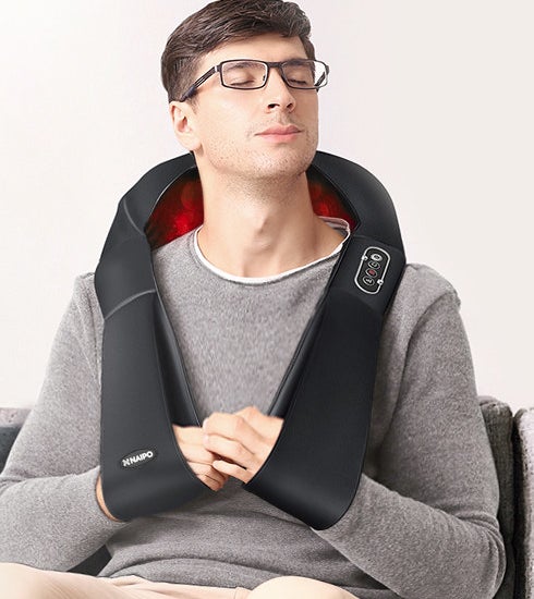 A person using the vest with their arms in the little arm slings 