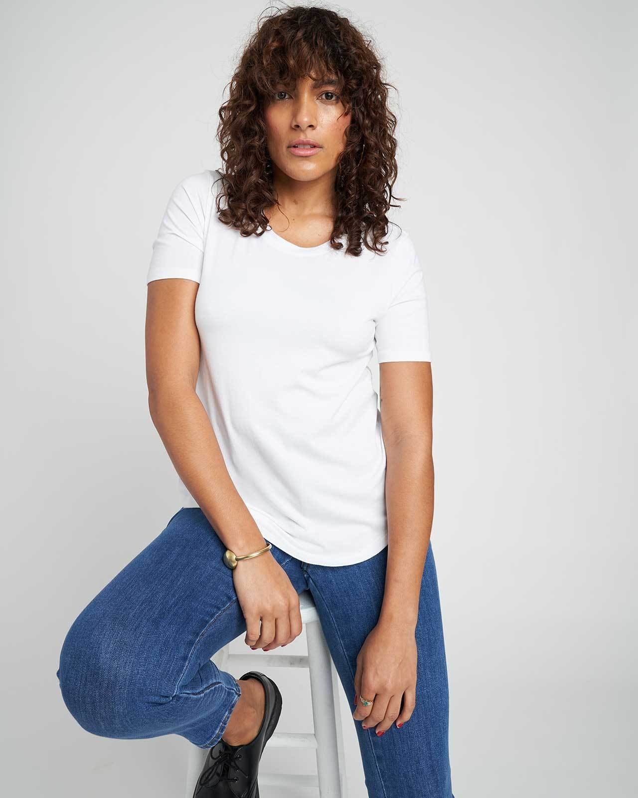 a model wearing the white tee