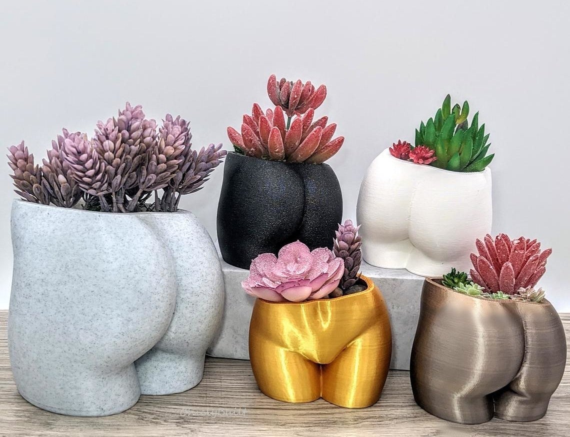 different colored planters that look like butts