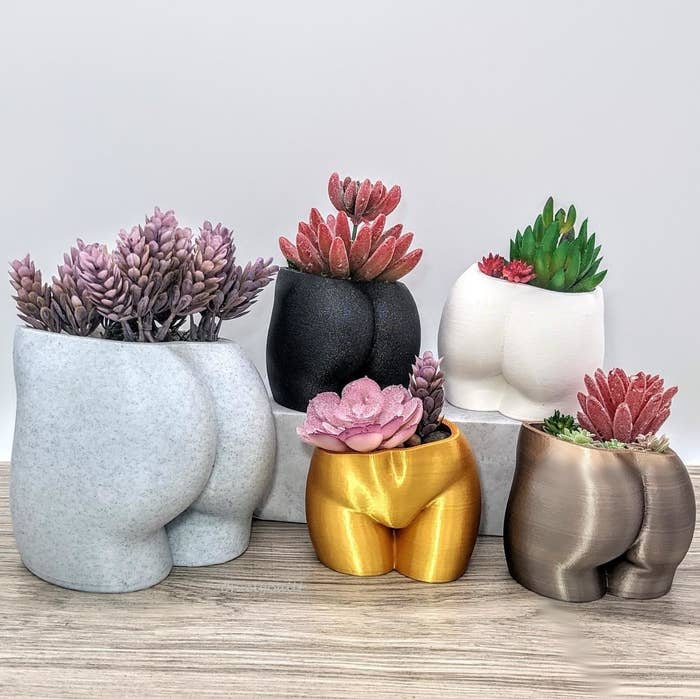 different colored planters that look like butts