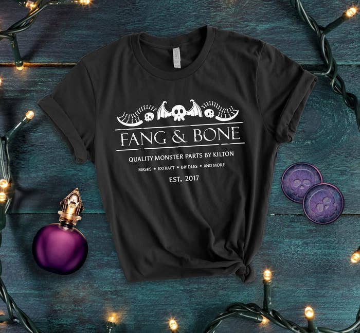 a tee that says fang and bone quality monster parts by kilton with some monsters parts