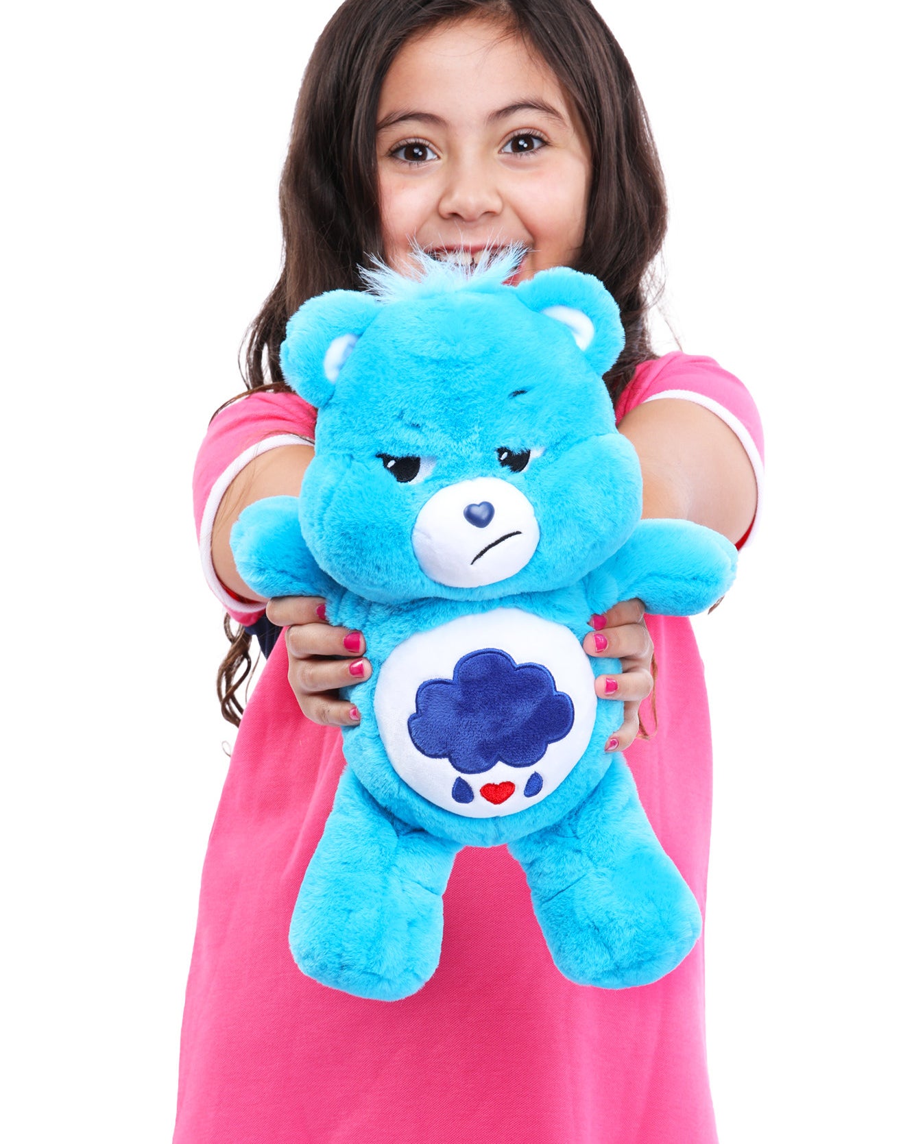 child holding up a blue grumpy-looking care bear