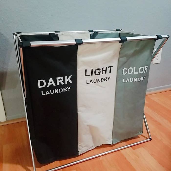 the black, white, and blue laundry hamper with sections for colors, darks, and light clothes