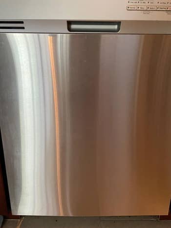 reviewer image of the same dishwasher door cleaned with the Weiman Stainless Steel Cleaner Wipes