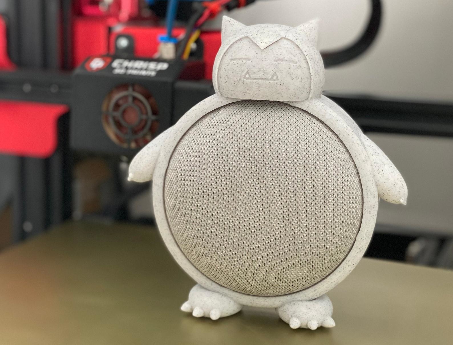 a gray 3d printed snorlax over a google nest speaker