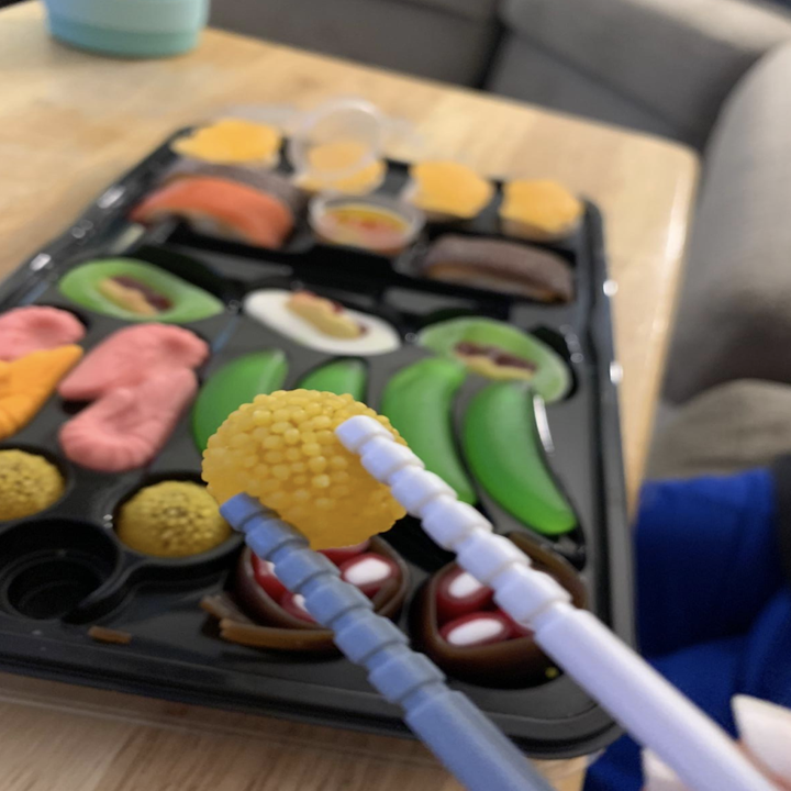 Reviewer image of candy sushi held in chopsticks