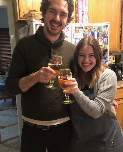 Man and woman toasting glasses of beer