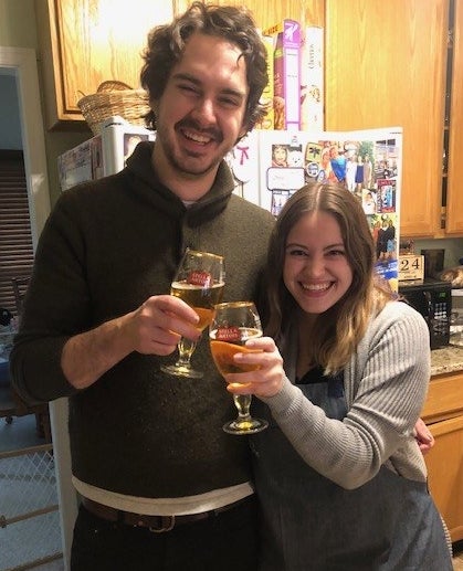 Man and woman toasting glasses of beer