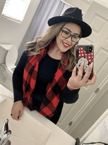 reviewer wears red and black buffalo plaid scarf 