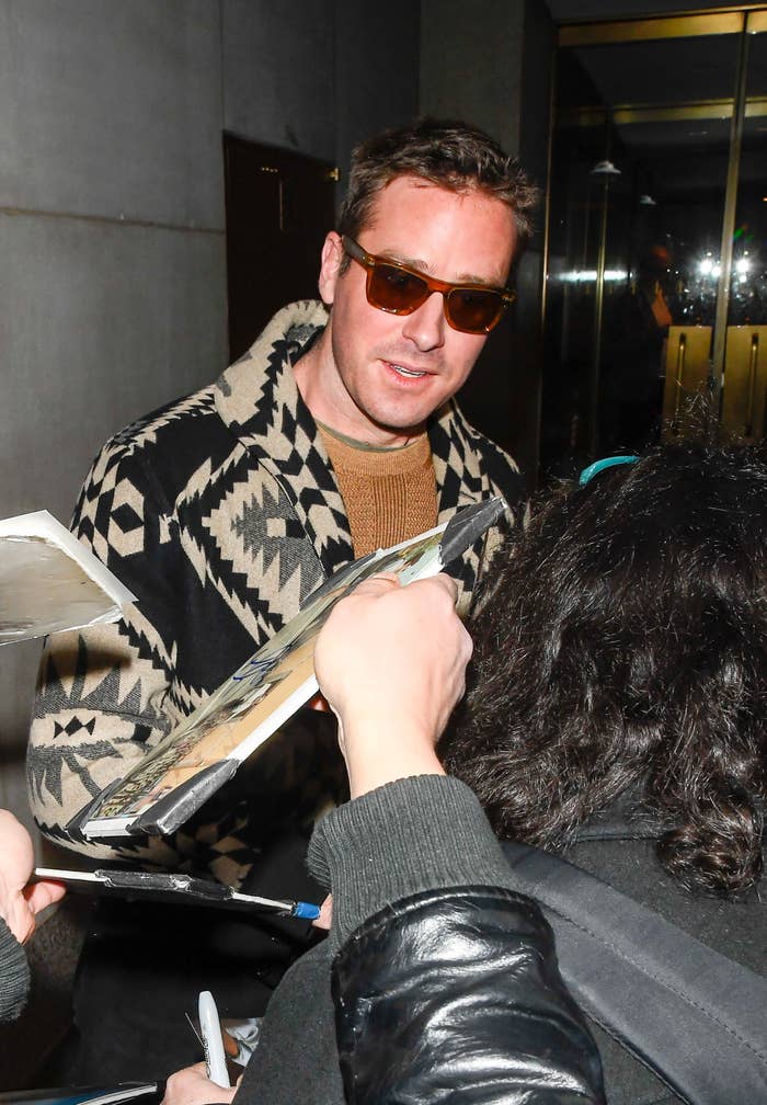 Hammer signs autographs while wearing a jacket, a sweater, and sunglasses outside the Today Show in New York City on March 9, 2020