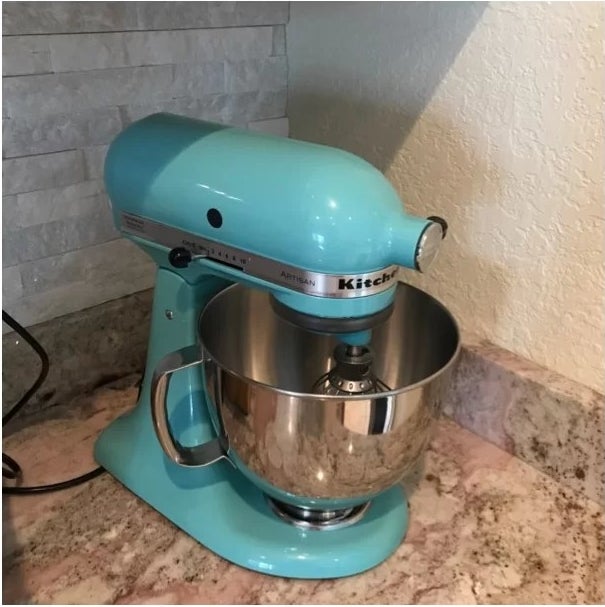 The mixer placed in the corner of a kitchen countertop
