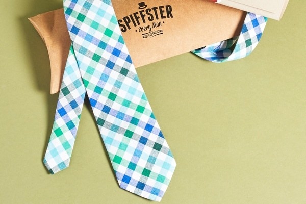 a blue. green, and white checkered tie
