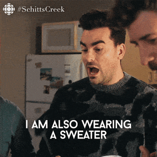 gif of David from the television show Schitts Creek saying I am also wearing a sweater