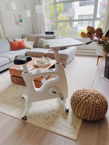 A reviewer's white stationary desk bike