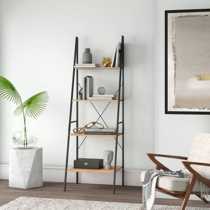 Metal ladder bookcase with natural wood finish