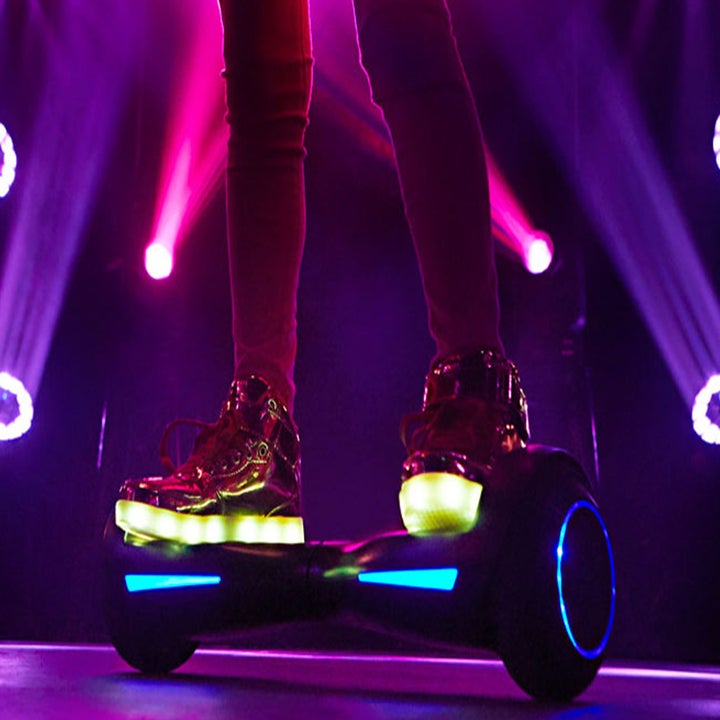 person on a hoverboard that has blue lights