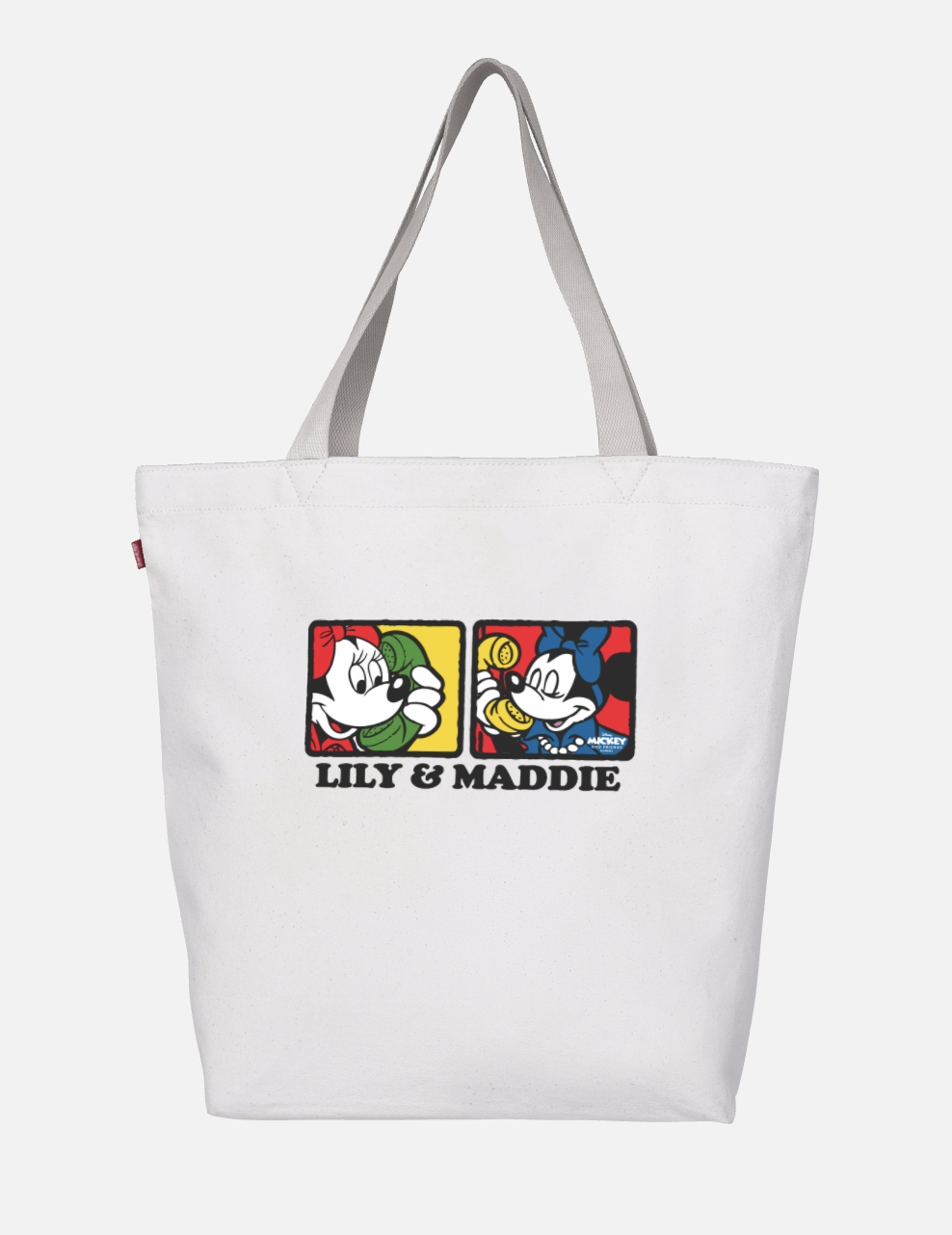 A white tote bag with two Minnie Mouses on it that says &quot;Lily &amp;amp; Maddie&quot; 