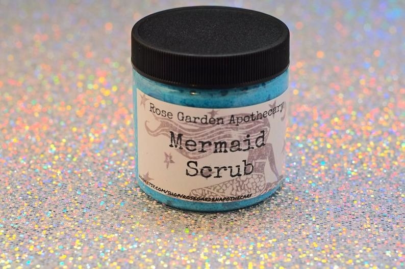 Jar of sea-blue body scrub that says &quot;Rose Garden Apothecary Mermaid Scrub&quot;