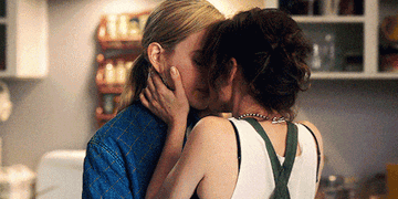 Dani and Jamie share a kiss in the kitchen