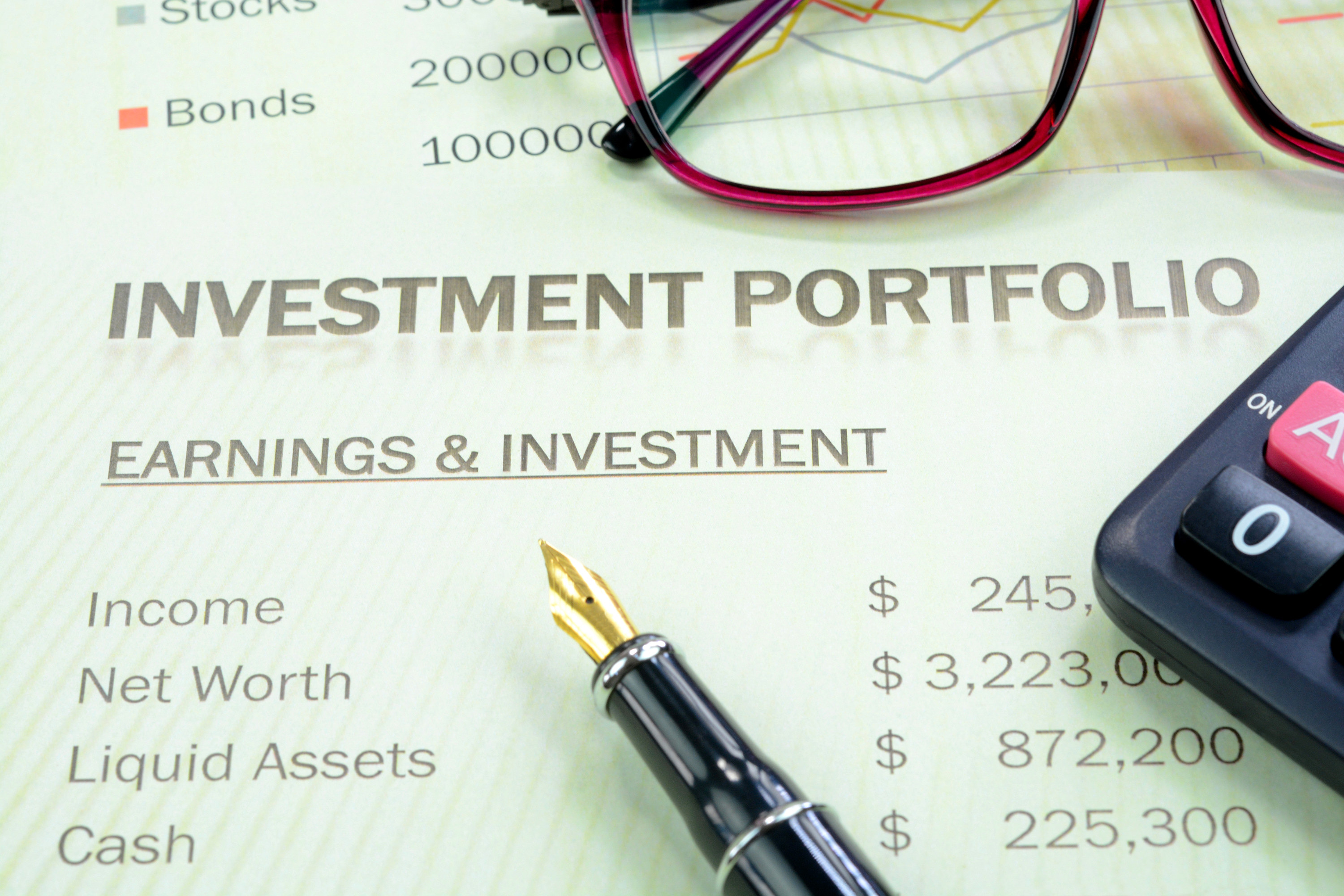 Paper that says &quot;investment portfolio&quot; and lists earnings and investments