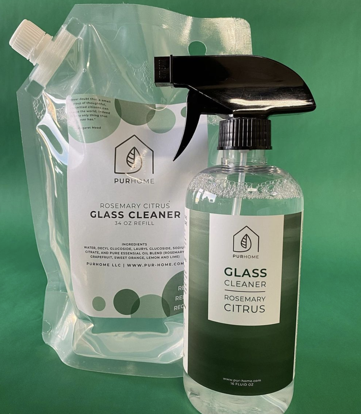 the bottle of the rosemary citrus glass cleaner spray bottle next to a re-fill bag