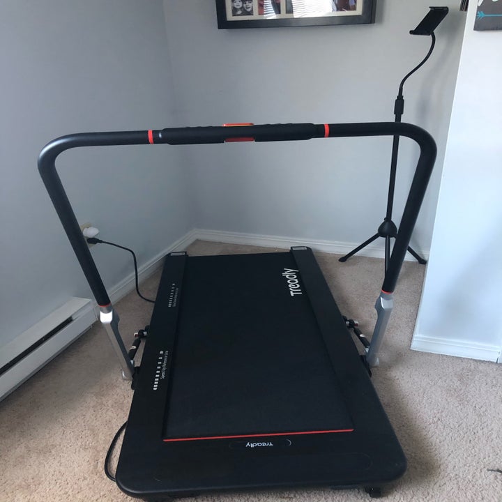 The treadmill with the handrail engaged
