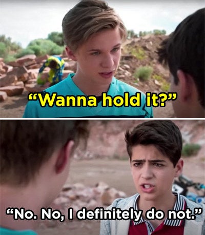 A kid asking Cyrus if he wants to hold a gun