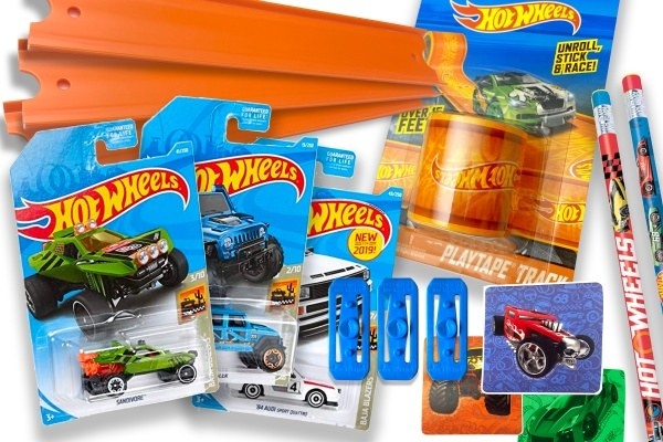 multiple Hot Wheels cars with race tracks, pencils, and other themed accessories