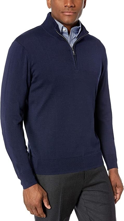 A model wearing the sweater in blue