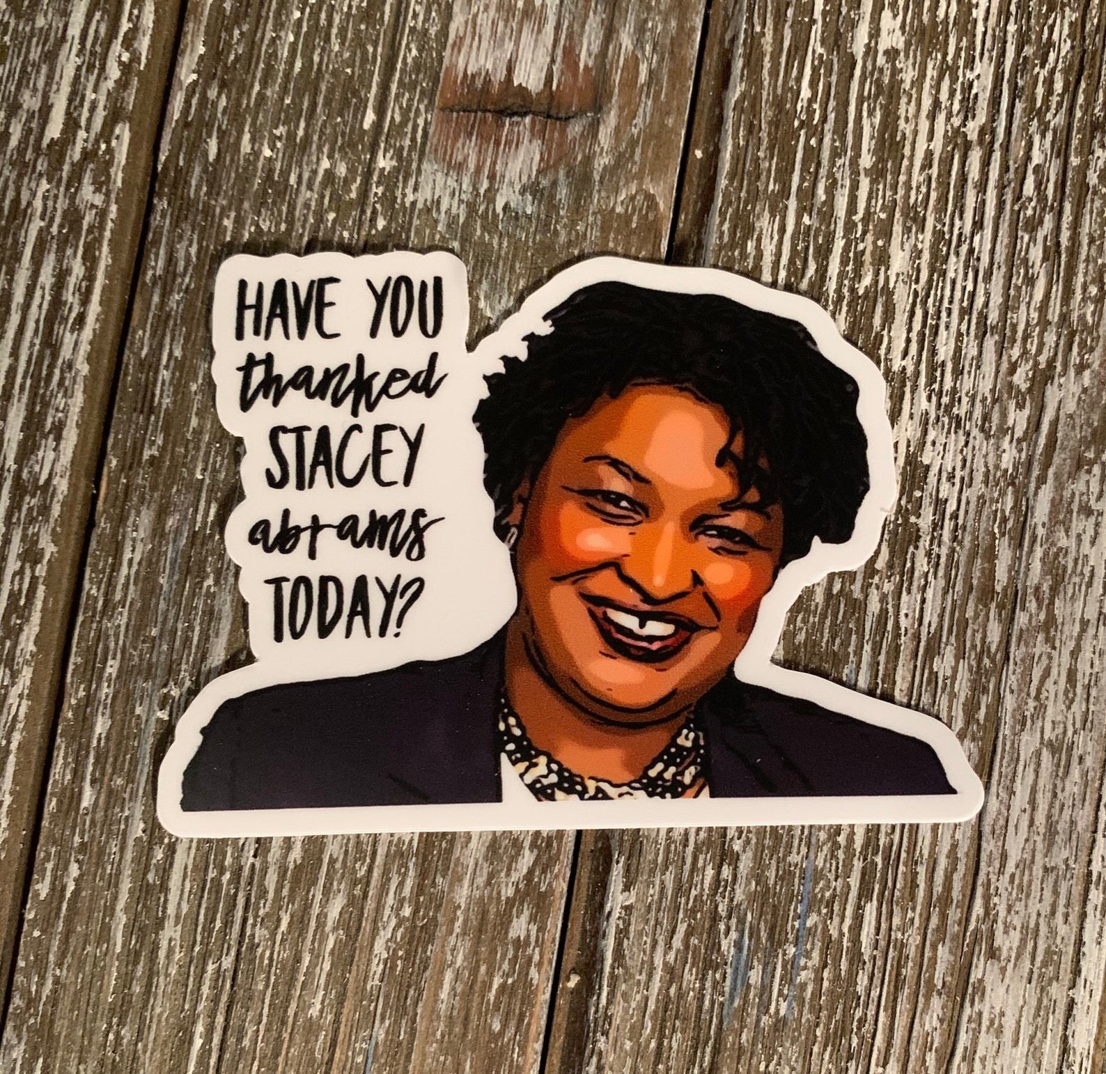 sticker that says, &quot;Have you thanked Stacey Abrams today?&quot; with her smiling face on it