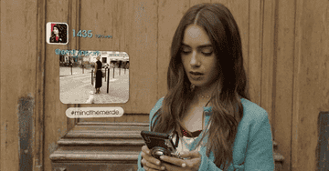 A GIF of Emily in Paris scrolling on her phone