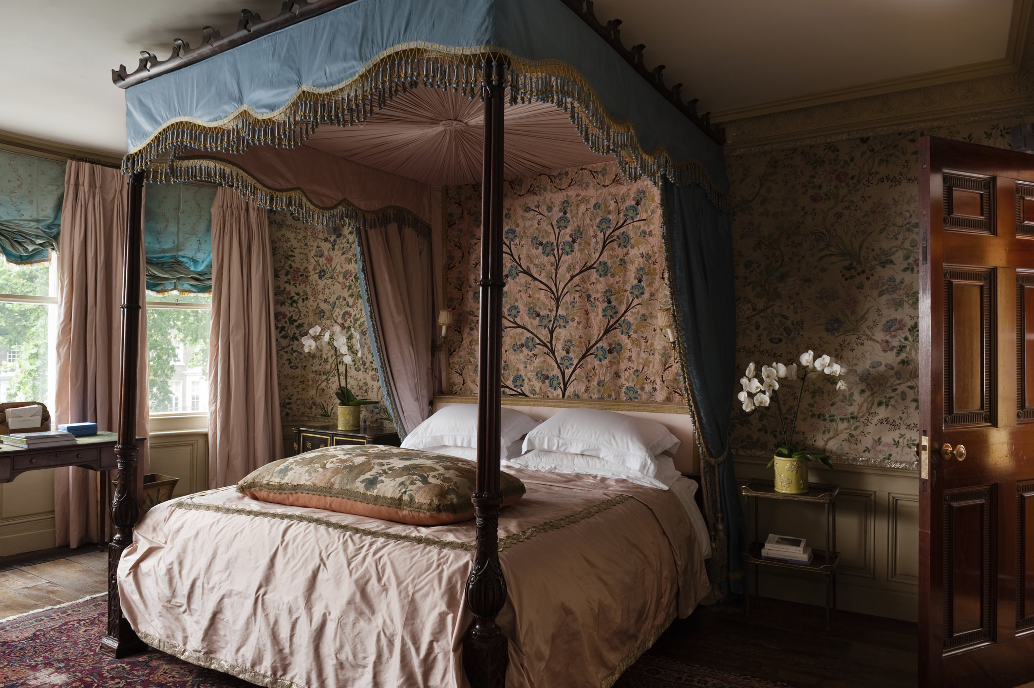 A four-poster bed in a a London apartment styled in the Georgian period