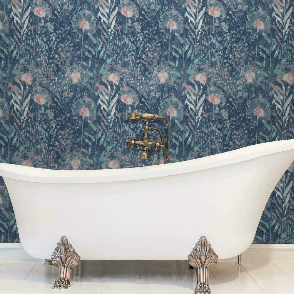 the floral wallpaper in red and blue behind a bath tub
