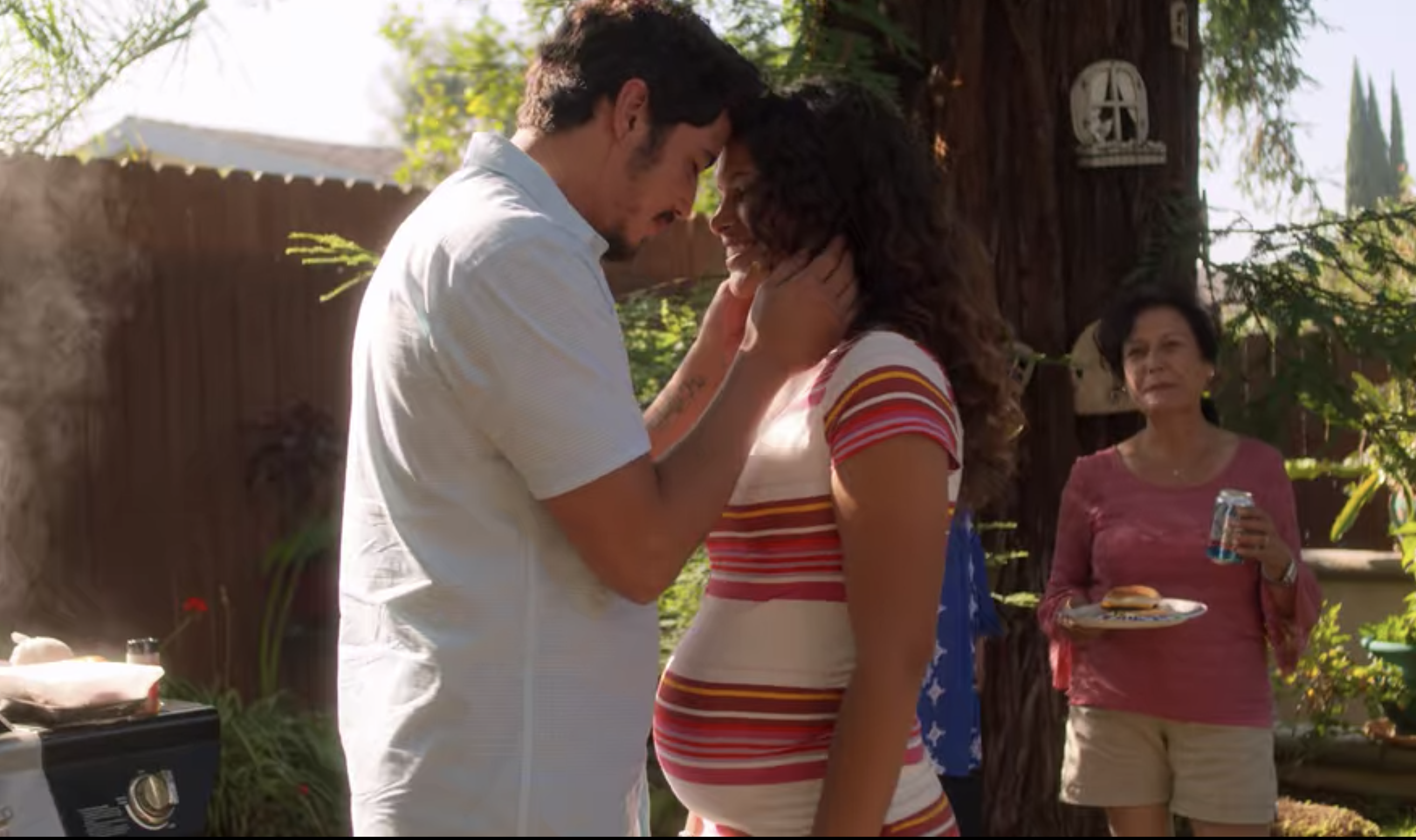 Two characters hugging, with one of them pregnant