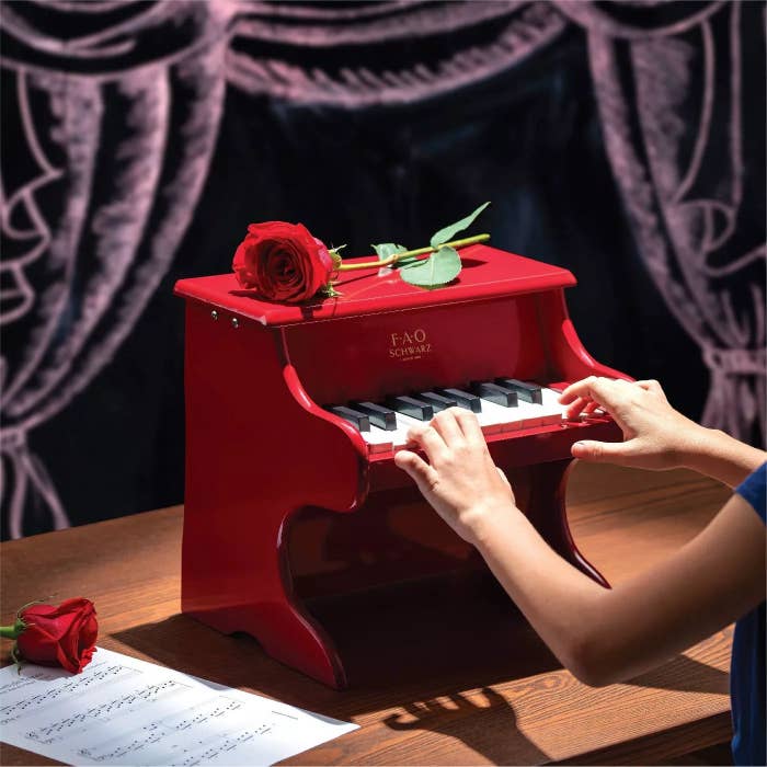 The red FAO Schwartz piano
