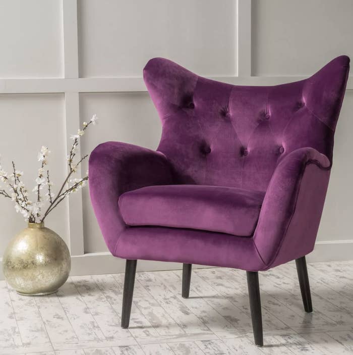 A vibrant purple accent chair