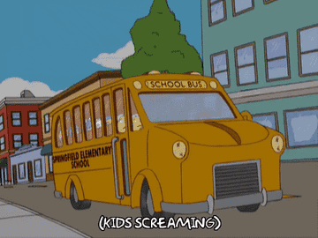 A school bus weaving on the road with the kids inside screaming