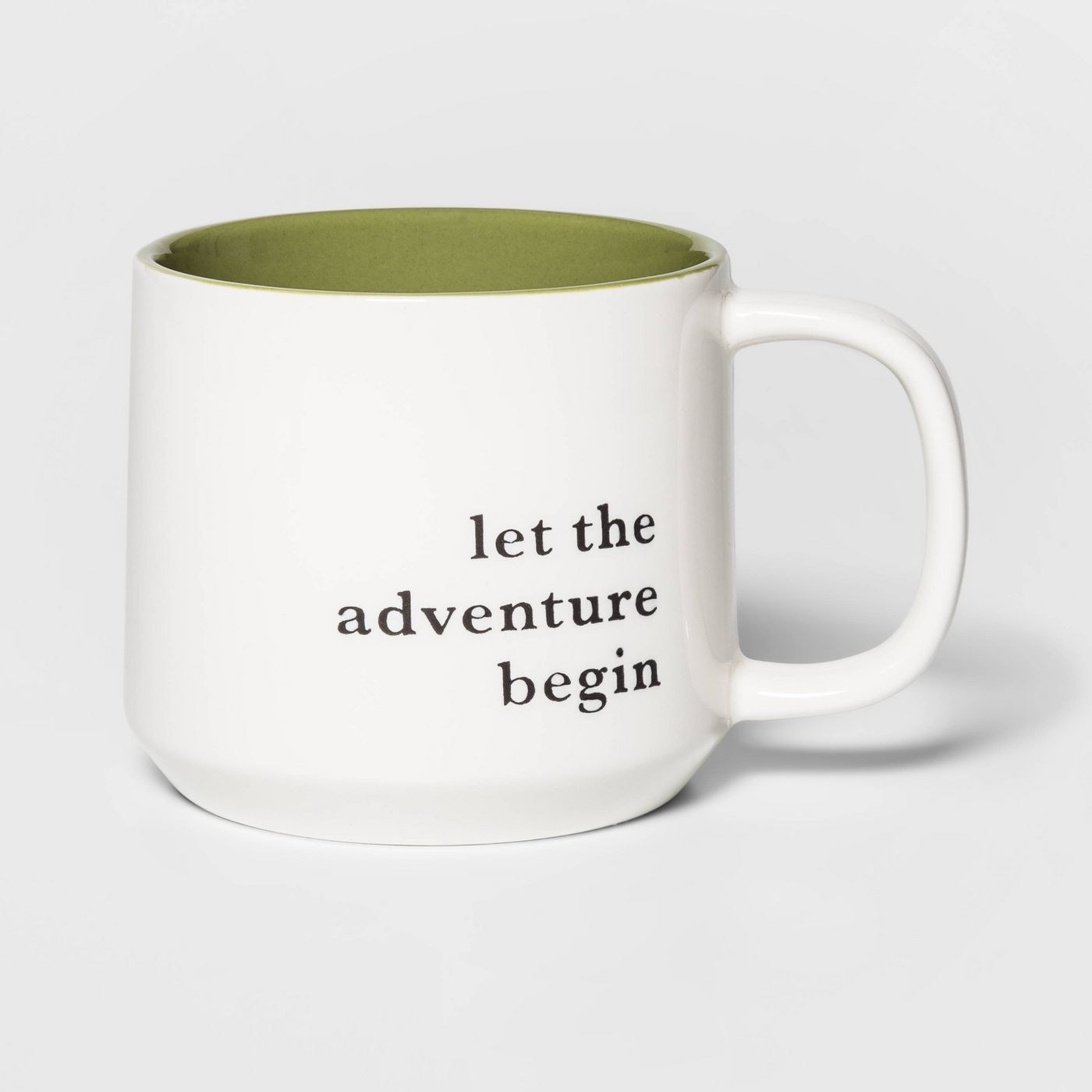 A mug that says &quot;let the adventure begin&quot; 