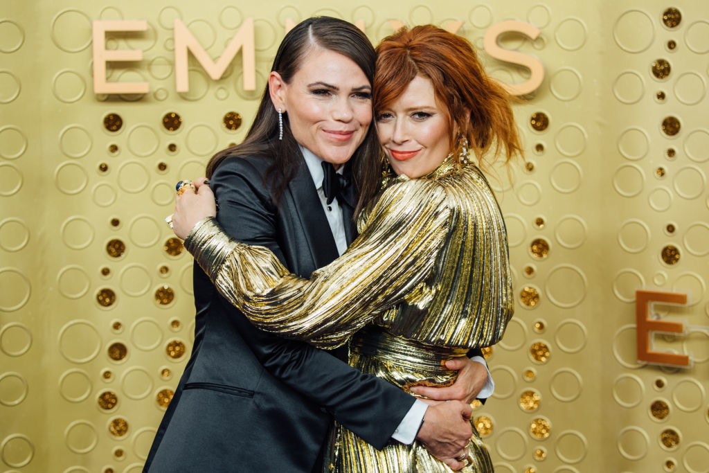 Clea DuVall and Natasha Lyonne hugging each other on the red carpet at the 71st Emmy Awards